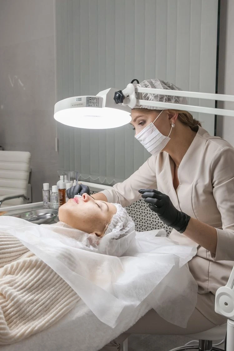Practitioner performing a facial skin treatment