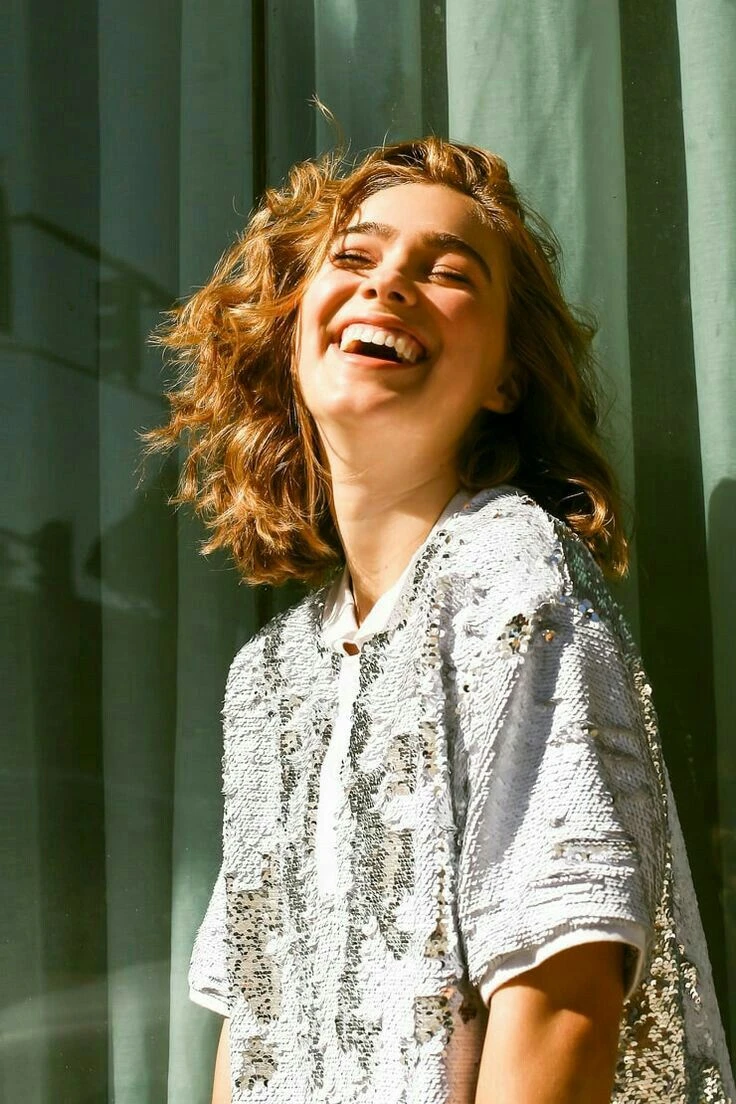 Woman laughing with a confident smile