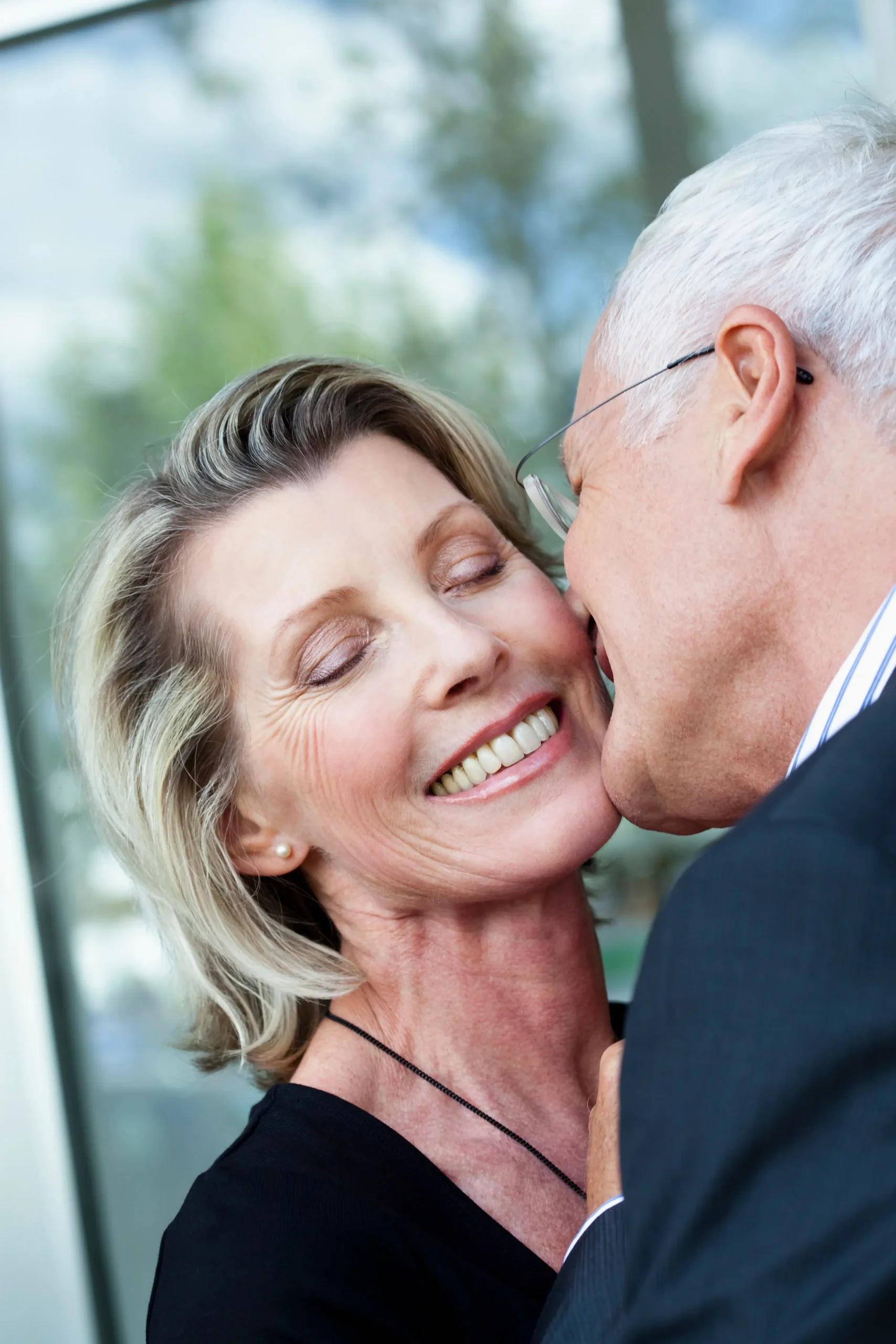 Affectionate mature couple sharing a kiss
