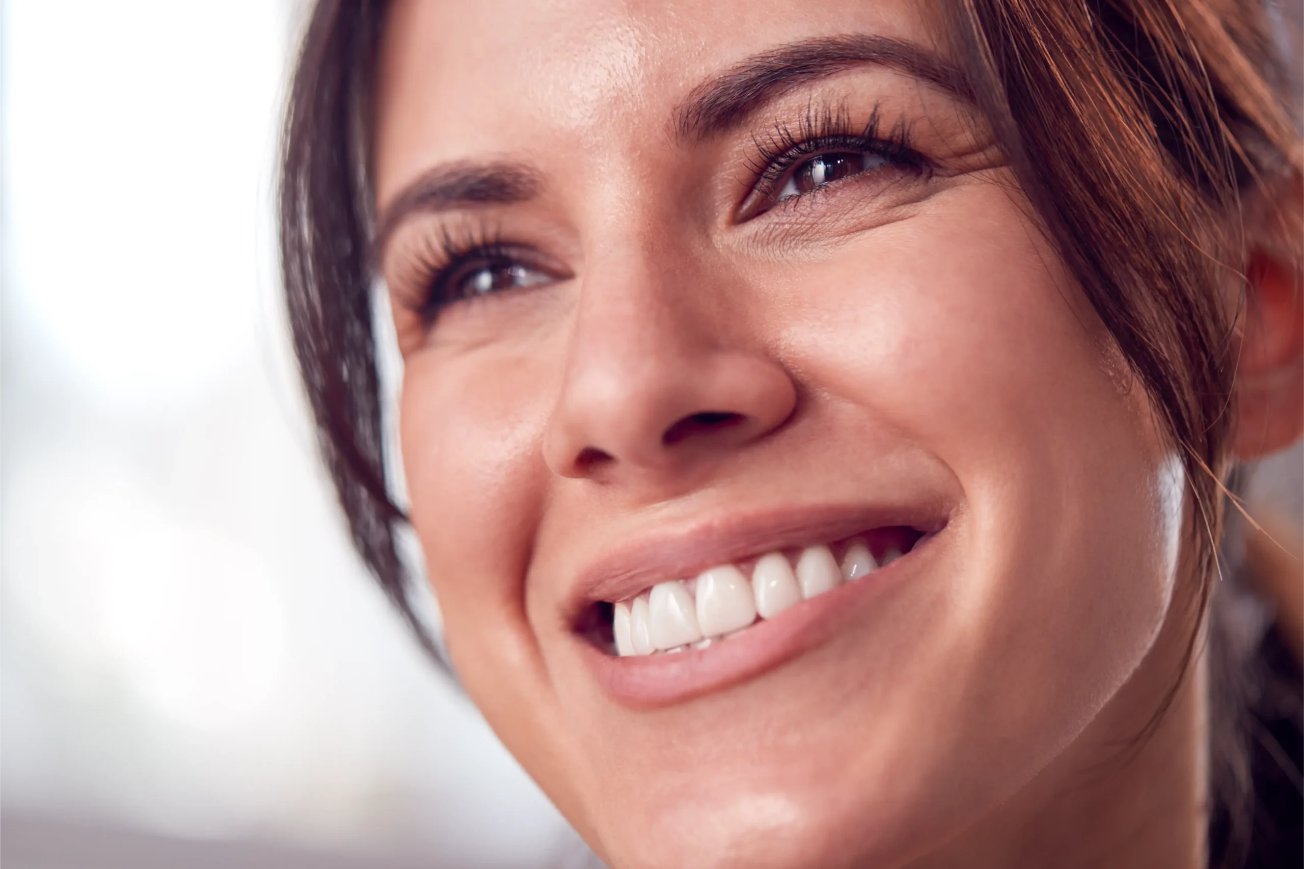 Close-up portrait of a relaxed, natural-looking woman