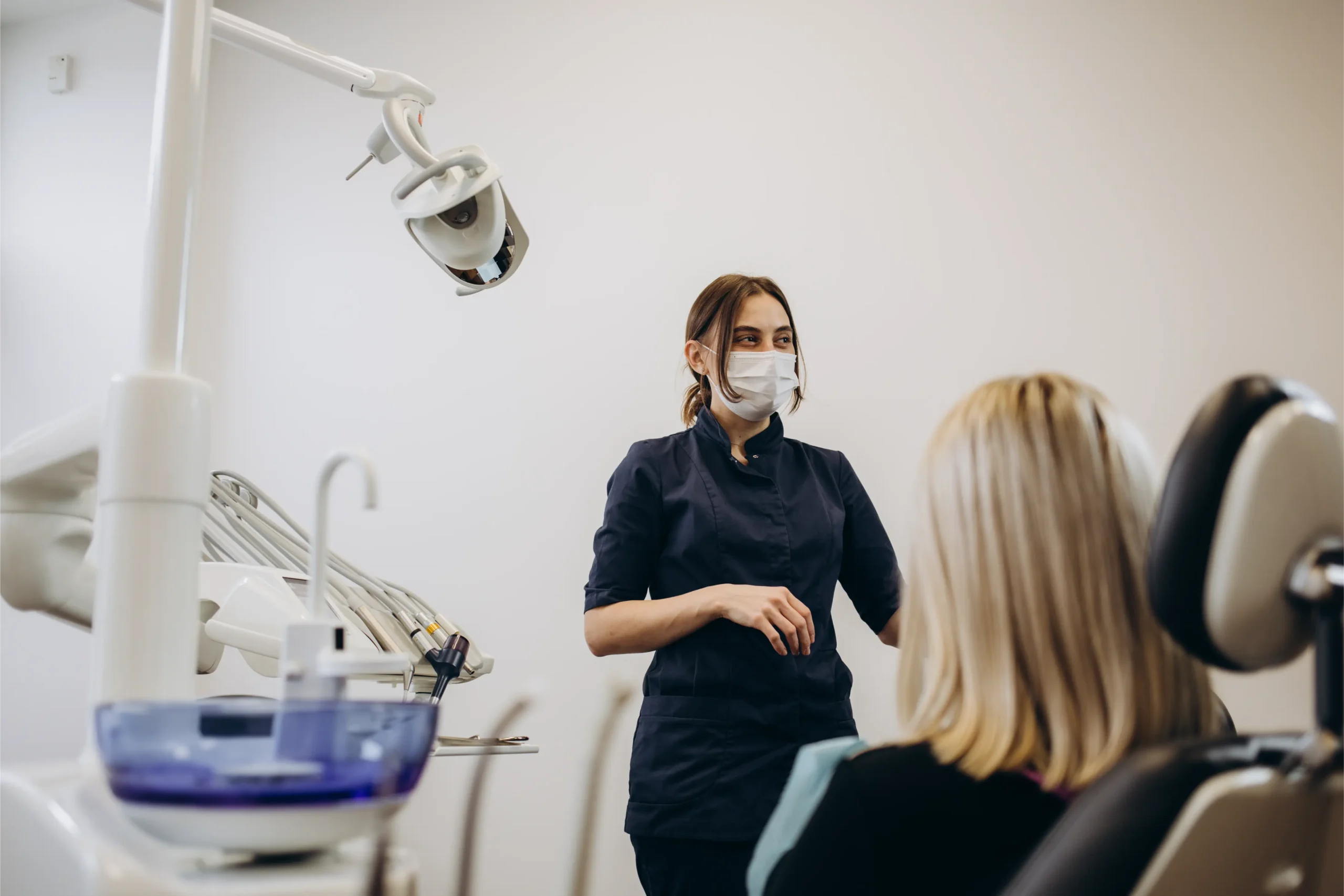 Dentist examining a patient's teeth in a modern clinic