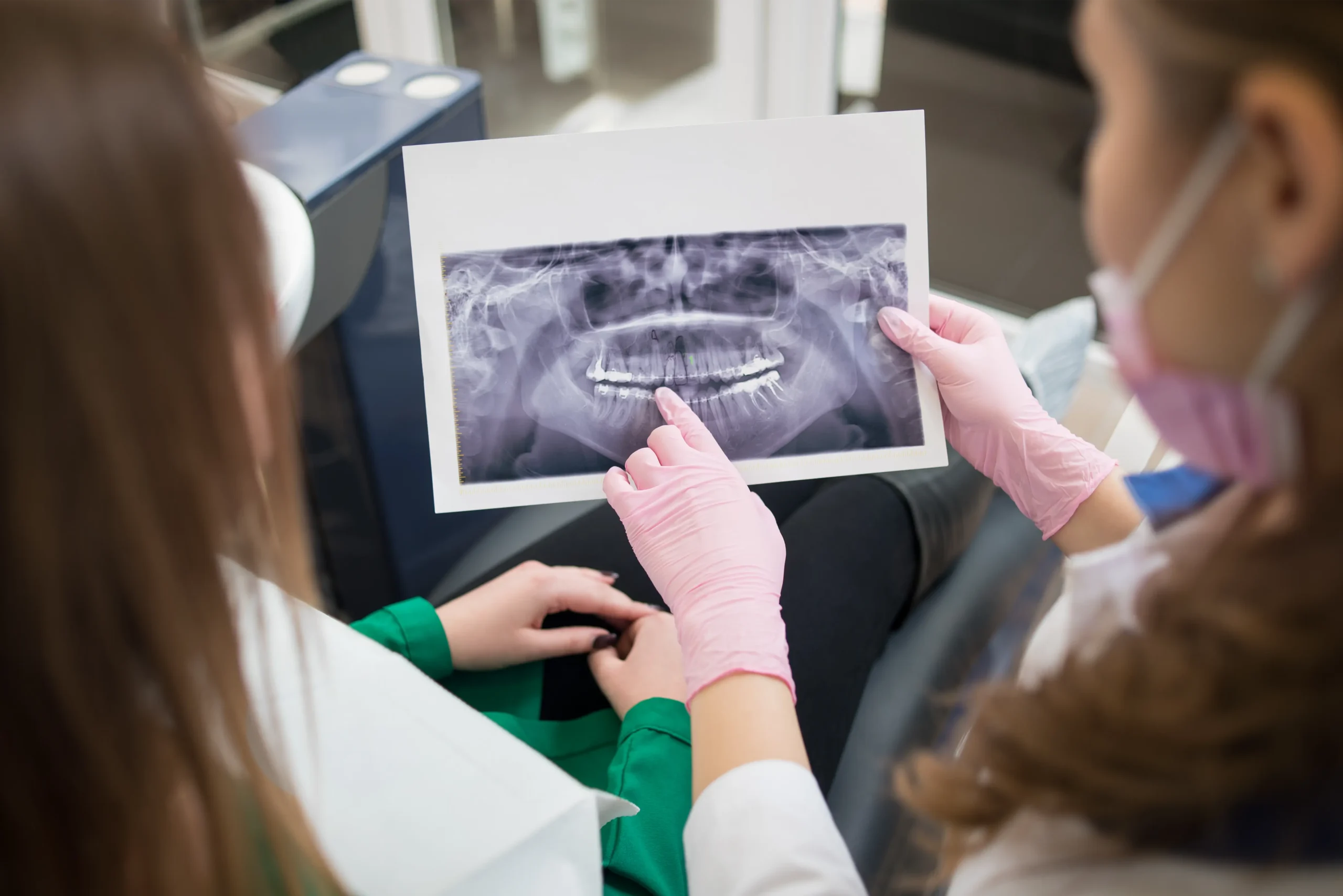 Dentist explaining an X-ray to a patient