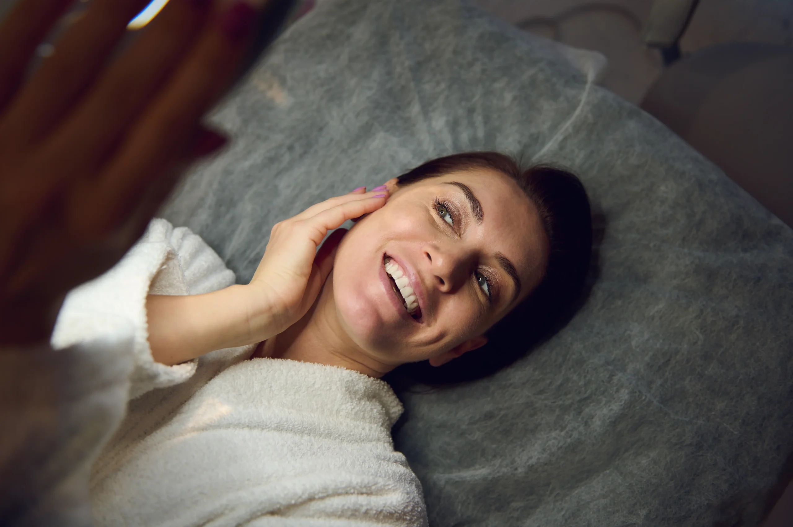 Woman laughing as she relaxes