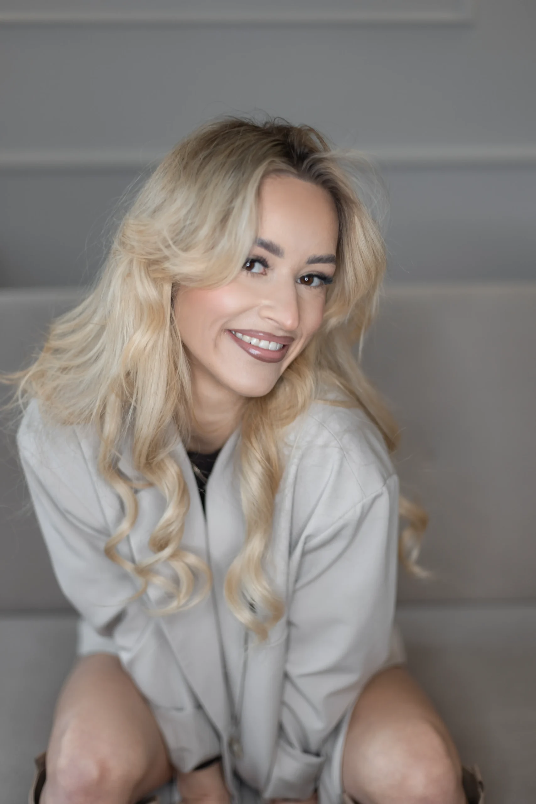Smiling woman with long blonde hair