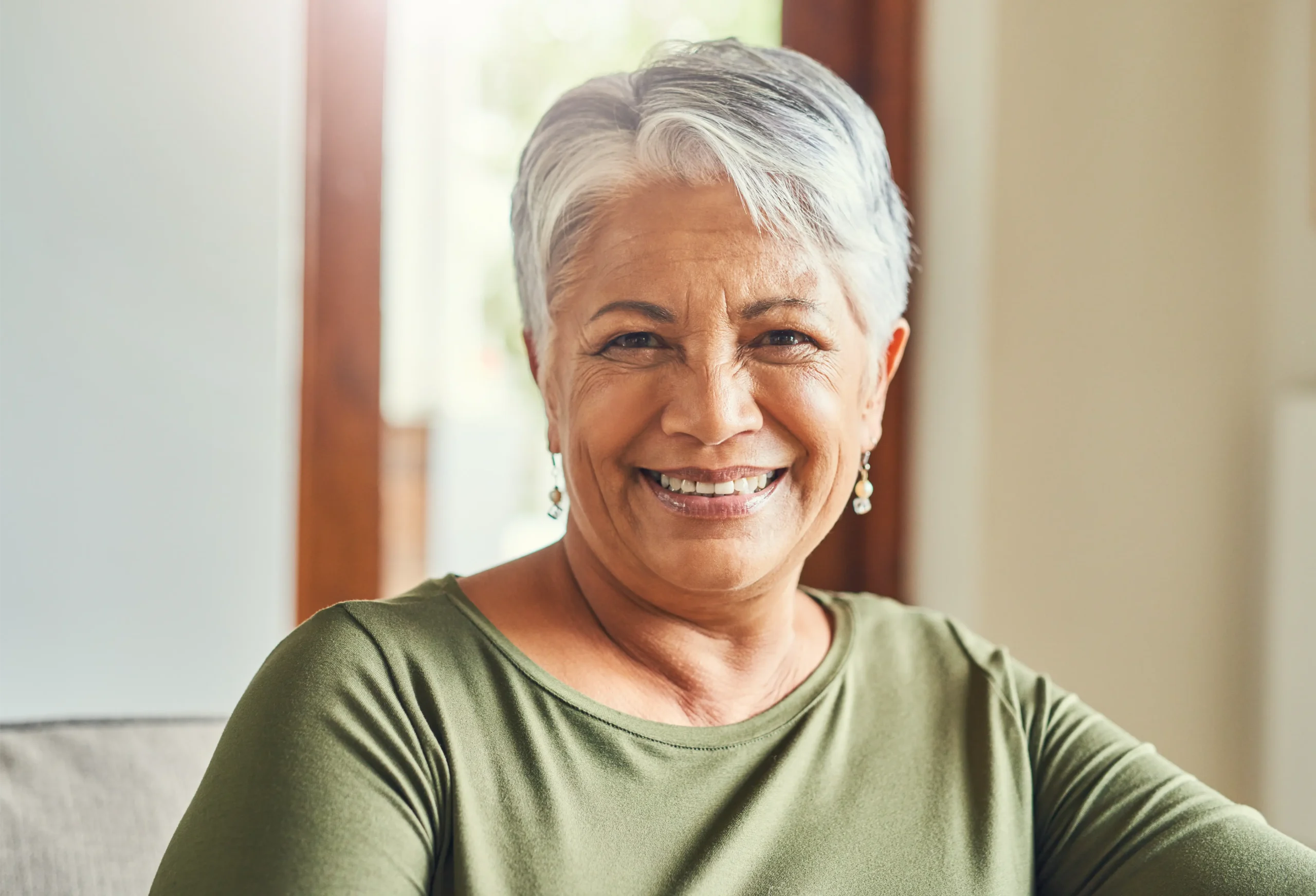 Smiling mature woman with short grey hair