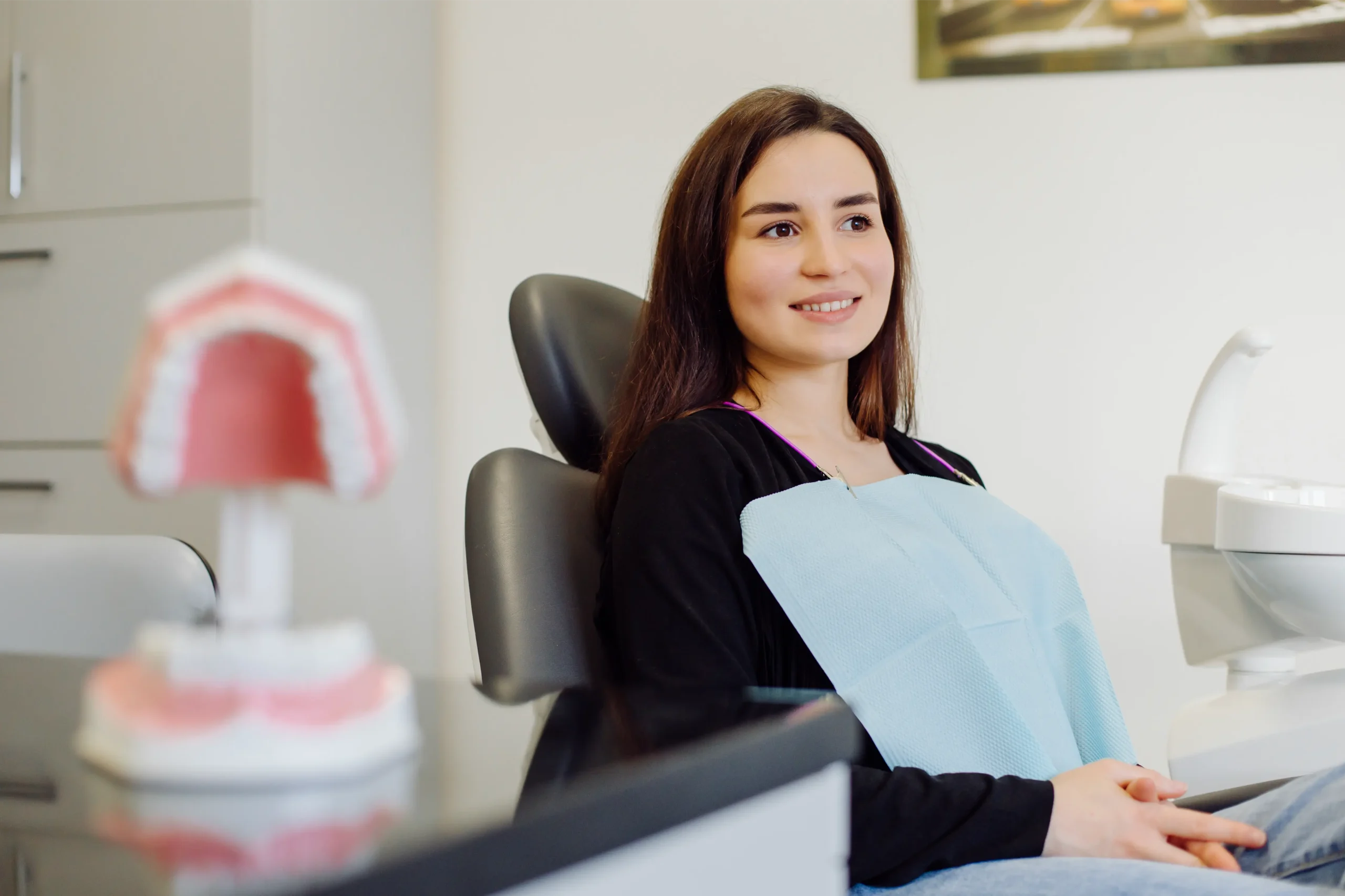 Young woman smiling in the dental chair