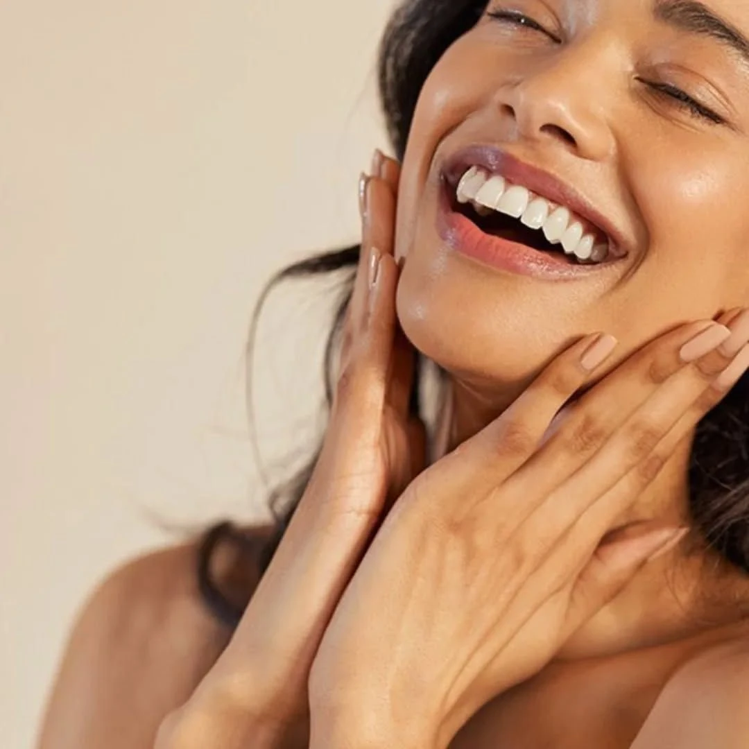 Laughing woman with radiant skin
